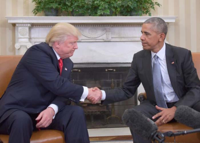 U.S. President Barack Obama shakes hands with Donald Trump