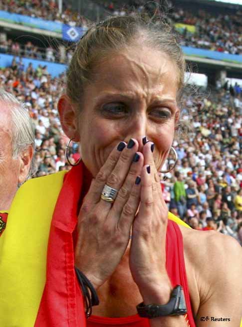 Natalia Rodriguez of Spain holds back tears after winning in the women's 1500 metres final during the world athletics championships at the Olympic stadium in Berlin, August 23, 2009. Gelete Burka of Ethiopia was leading the race but stumbled and Rodriguez won. Rodriguez disqualified & lost the Gold.