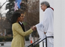 (AP) President-elect Barack Obama and Michelle Obama are welcomed by Rev. Luis Leon as they arrive for church service at St. John's Episcopal Church across from the White House in Washington, Tuesday, Jan. 20, 2009.