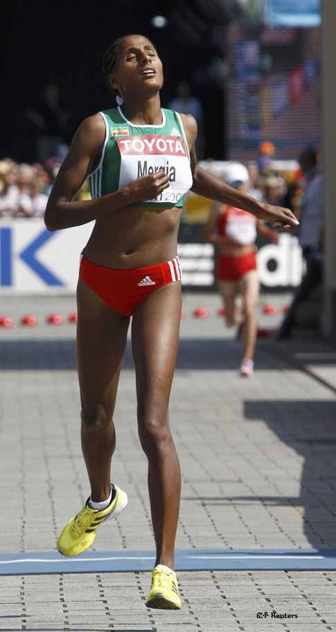Aselefech Mergia of Ethopia crosses the finish in third place in the women's marathon at the 12th world athletics championships in central Berlin August 23, 2009.