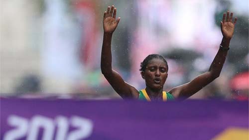አትሌት ቲኪ ገላና በለንደኑ ኦሎምፒክ የሴቶች ማራቶን በአሸናፊነት ክብረወሰን ስትሰብር Tiki Gelana of Ethiopia celebrates winning the Marathon አትሌት ቲኪ ገላና በለንደኑ ኦሎምፒክ የሴቶች ማራቶን በአሸናፊነት ክብረወሰን ስትሰብር Tiki Gelana of Ethiopia celebrates winning the Marathon