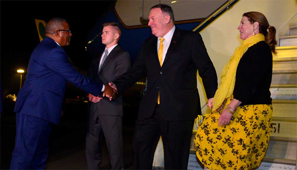 U.S. Secretary of State Mike Pompeo (2nd-R) and his wife Susan Pompeo (R) are welcomed by Ethiopia’s Foreign Minister Gedu Andargachew (L) after they arrived in Addis Ababa, Ethiopia February 17, 2020. Andrew Caballero-Reynolds/Pool via REUTERS